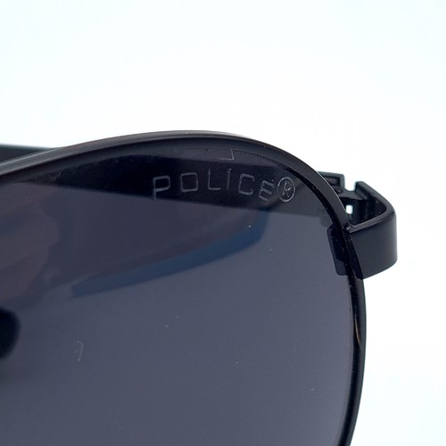 516 - A pair of aviator police sunglasses, with police marked to red detail stems. In very good  condition... 