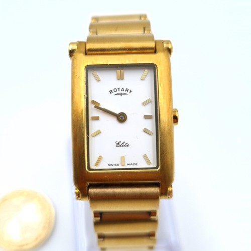 522 - A Rotary Swiss made Elite wrist watch, featuring a gold toned bracelet, white enamelled face and bat... 