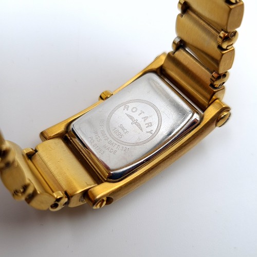 522 - A Rotary Swiss made Elite wrist watch, featuring a gold toned bracelet, white enamelled face and bat... 