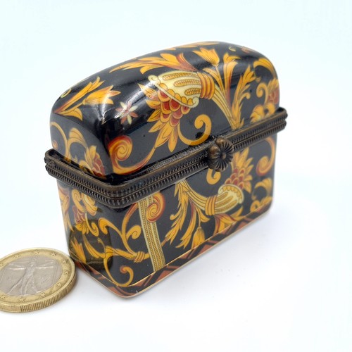 523 - A vintage French porcelain floral motif hinged casket, encased are three brass topped scent files. L... 