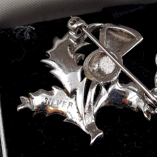 532 - Three sterling silver brooches, each of a Celtic design. Total weight: 21.19 grams. All pins intact.... 