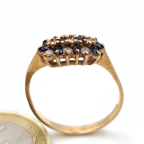 546 - A 9 carat gold Sapphire and Zircon cluster ring. Ring size: N. Weight: 1.58 grams.