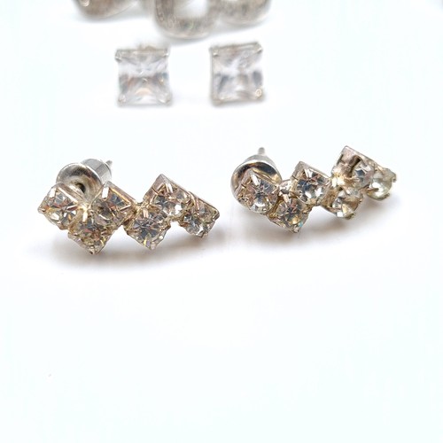 549 - A large and assorted collection of sterling silver gem set stud earrings, in an array of styles of d... 