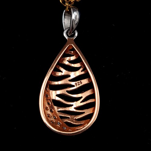 563 - A fabulous Rose gold toned gem set pendant and chain. Length of chain: 44cm. Boxed, old new stock.