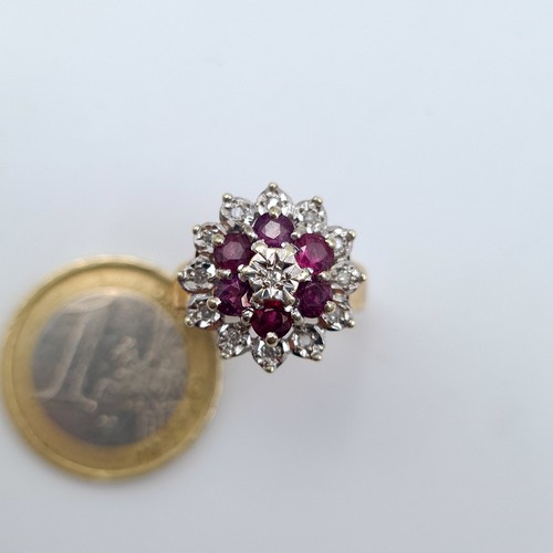 569 - Star Lot: A 9 carat gold wide band Ruby and and single cut Diamond cluster ring. This stunning ring ... 