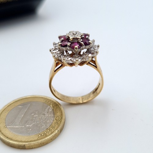 569 - Star Lot: A 9 carat gold wide band Ruby and and single cut Diamond cluster ring. This stunning ring ... 