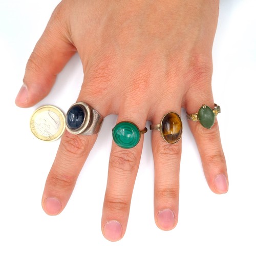 576 - A collection of four Sterling silver and Silver gilt cocktail rings, set with precious gems includin... 