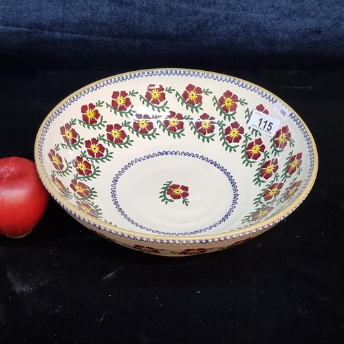 115 - A large Nicholas Mosse studio pottery bowl in the Old Rose spongeware pattern. D27cm. A shallow bowl... 