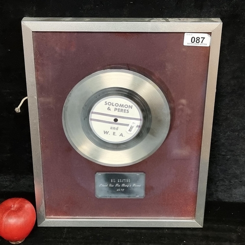 87 - A framed display holding a silver toned single record from Solomon & Peres and W.E.A. to the Irish p... 