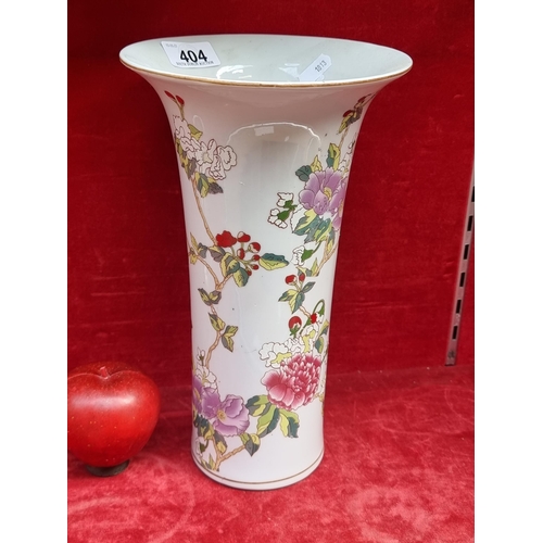 404 - A tall ceramic vase with a flared rim and a cherry blossom motif in shades of pink, purple and red. ... 