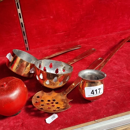 417 - Four pretty brass and copper plated kitchen utensils including a ladle, a neatly proportioned pot, a... 