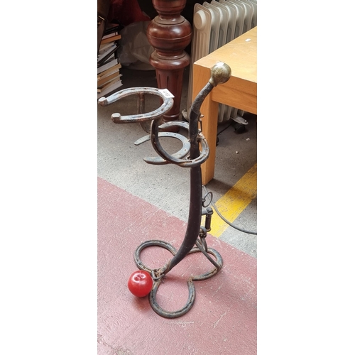 418 - A fabulous vintage hand forged umbrella stand crafted from horse shoes and horse hames. A very uniqu... 