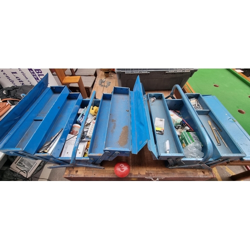 445 - Two metal accordion tool boxes in a sky blue shade. With a collection of screws and other DIY items.