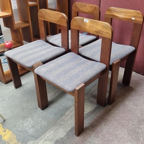 448 - A set of four fabulous Mid Century Modern dining chairs with sleek wooden frames featuring a carved ... 