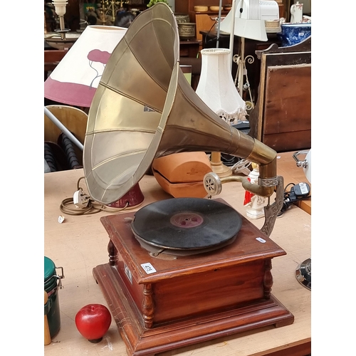 475 - A early 20th century Gramophone record player by His Master's Voice. Featuring a stained wood base a... 