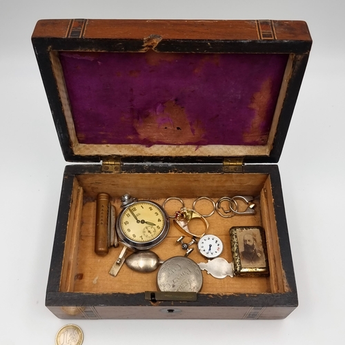 A collection of twelve items, comprising of five rings, a pill box, a wrist watch, a vintage lighter