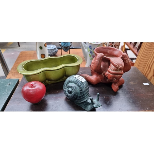 621 - A mixed lot of tree colorful garden objects; comprising of a fabulous Shorter & Son ceramic planter,... 