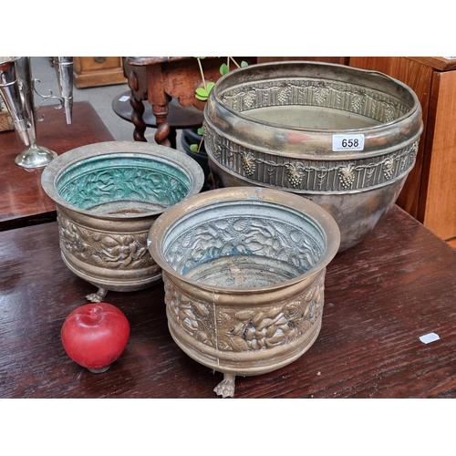 658 - A trio of wonderful 19th century church brass planters. Including a matching pair with gorgeous claw... 