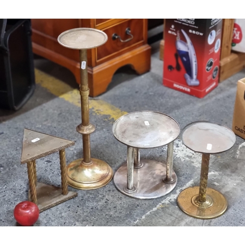 682 - A crate containing four 19th century church metal plant stands/candle holders including an example w... 