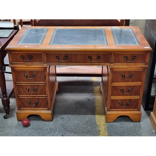 686 - Star Lot : A handsome vintage writer's desk with tooled leather inlayed panels to top featuring gilt... 