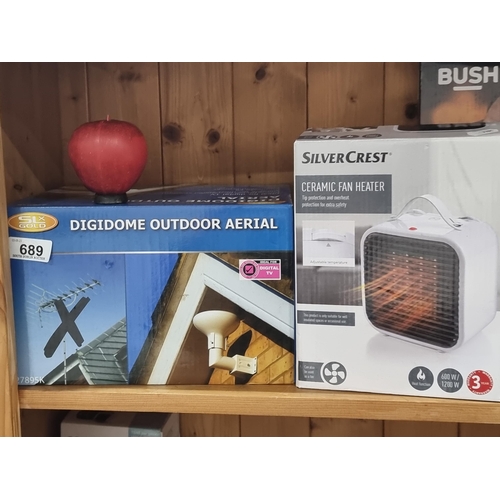 689 - Two items including a Silvercrest Ceramic Fan heater and a digidome outdoor aerial, both in original... 