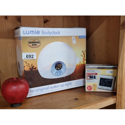 692 - A Lumie bodyclock with gentle wake-up light that wakes you with a natural sunrise effect, and a Silv... 