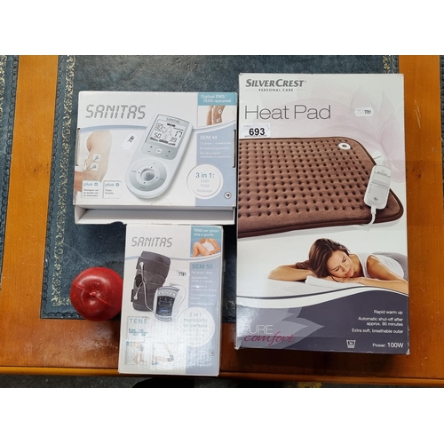 693 - Three home care medical items including a Sanitas knee or elbow massager device, a Sanitas blood pre... 