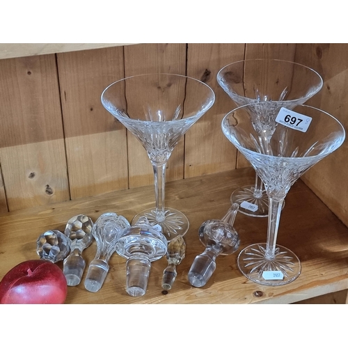 697 - Eight cut crystal items including three large Waterford crystal cocktail glasses in the Lismore patt... 