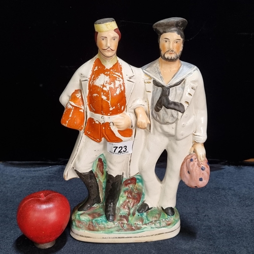 723 - A large and rare original early 19th century staffordshire ceramic flatback featuring a sailor and a... 