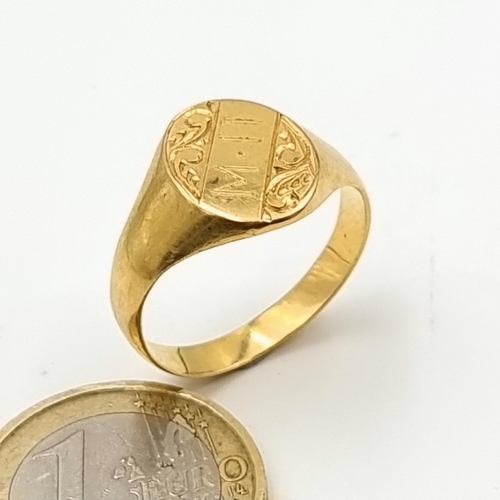 30 - Star Lot: A fine example of a heavy 18 carat gold marked gents signet ring, set with foliate and ini... 