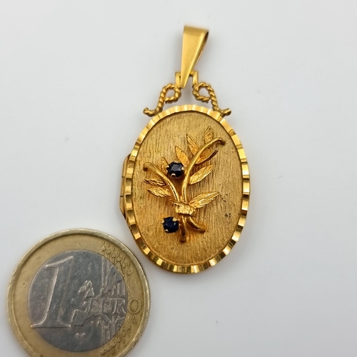 34 - Star lot : A beautiful and intricately formed antique 9 carat gold locket, set with a raised bright ... 