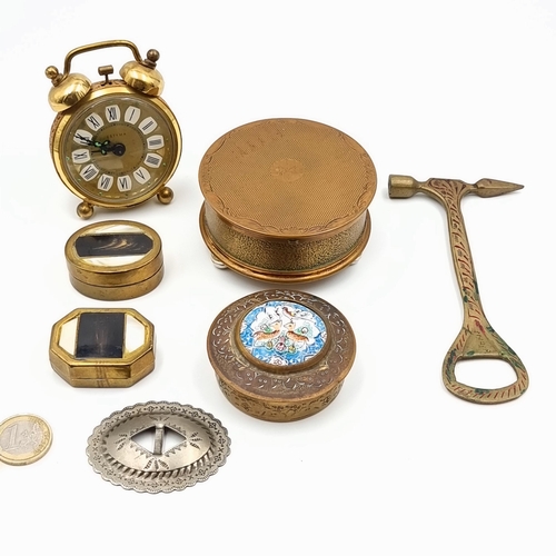 44 - A group of seven items, comprising of a stunning antique Estyla alarm travel clock, set with folaite... 