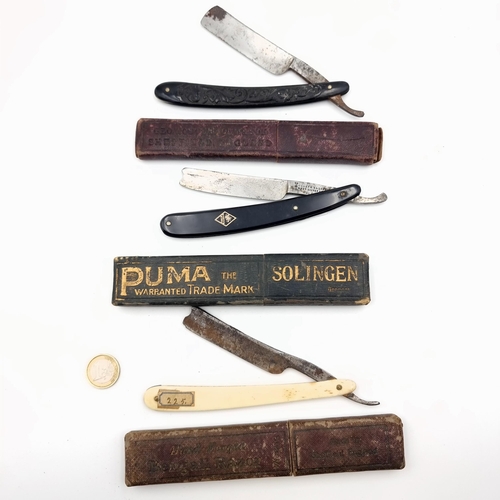 58 - Three vintage open bladed cut throat razors, set in their original boxes and featuring makers mark e... 