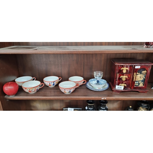 630 - A selection of ten Asian collectables. Including five handpainted Japanese teacups and a neat sized ... 