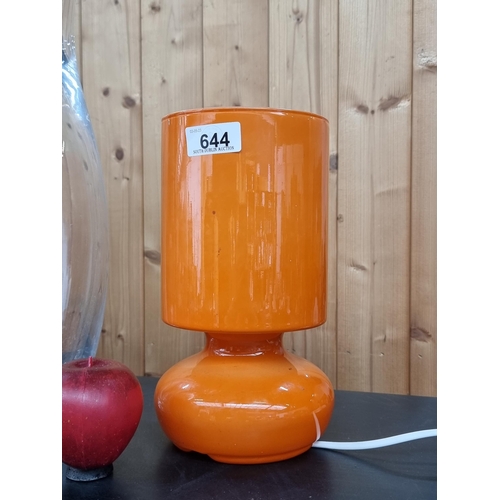 644 - A retro style LYTKA table lamp. Designed entirely in an orange clad milk glass with an integrated cy... 