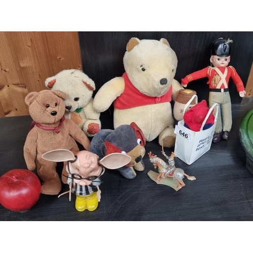 646 - A mixed lot of eight vintage children's toys. Including a vintage Winnie The Pooh with a straw fille... 