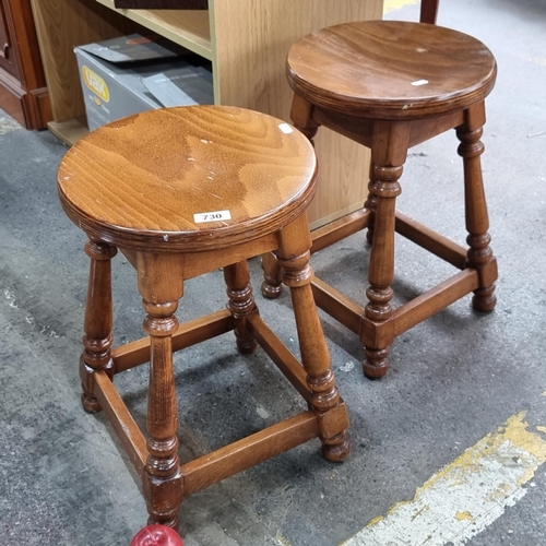 730 - Two vintage stools with turned wood legs. In good order, nice golden colour to the wood.