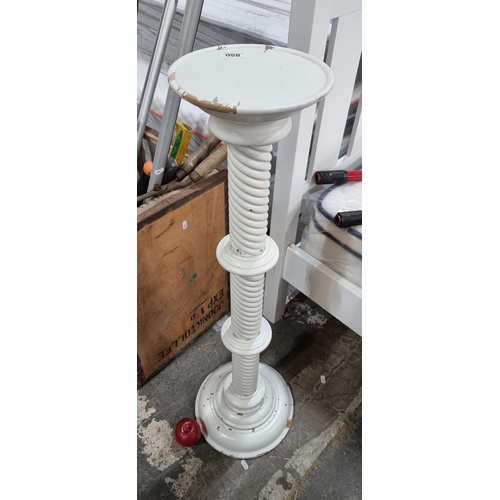 850 - A tall wooden plant stand with a rope twist stem and turned detailing. In a white distressed finish.... 