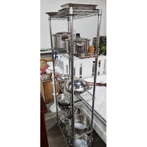 852 - A tall metal shelving unit with five wire shelves. Ideal for storage of kitchen equipment or tools. ... 