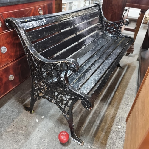 854 - Star lot : A wonderful antique very heavy  garden bench with wooden slats and cast iron bench ends b... 