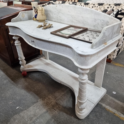 860 - Star lot : An ornate bow fronted console table with a marble top and tall gallery back. With a woode... 