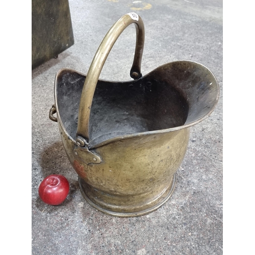 868 - A nicely sized brass coat scuttle with tall handle to top.