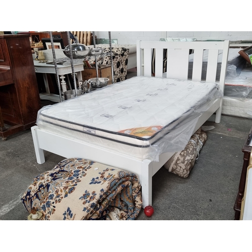 882 - A very nice, high quality 4ft double bed - as new with a fresh white wooden frame and slatted headbo... 