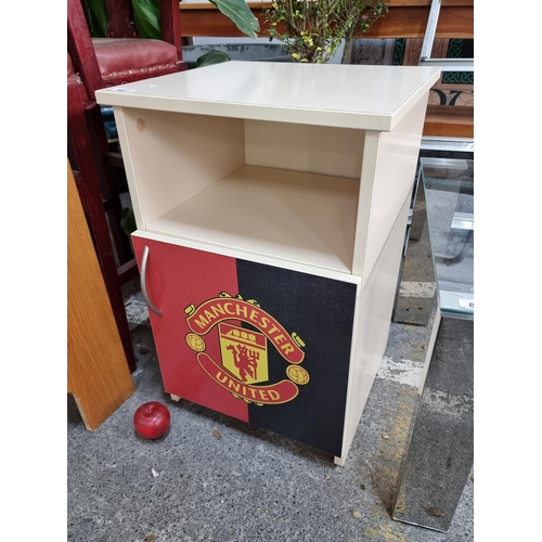 887 - A good sized bedside locker with open drawer and storage to base. Finished with a Manchester United ... 