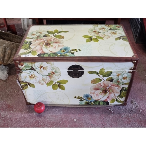 897 - A charming wooden chest with a floral design and leather reinforcements. With a Chinese style lock.