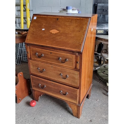 917 - Star Lot : A wonderful Edwardian honey mahogany secretary desk with a drop down table top placed on ... 