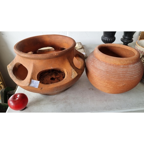 928 - Two nicely proportioned terracotta planters including one large  strawberry planter with cut out sid... 