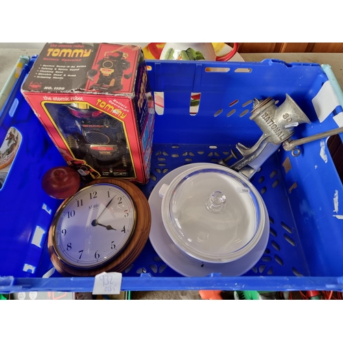 932 - A mixed lot including Tommy the Atomic Robot, a wall clock, a ceramic frying pan, a lidded baking di... 