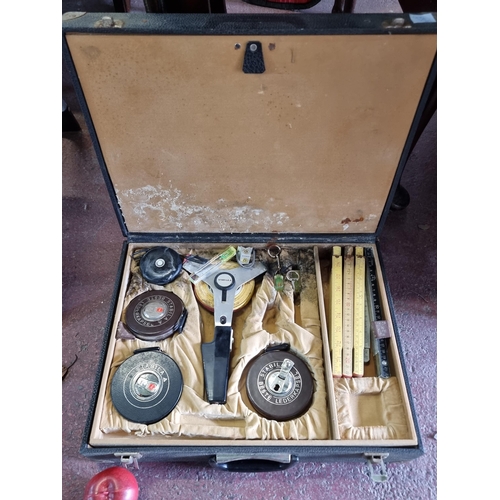 938 - A fabulous vintage surveyors kit with five different types of tape measure made by Stabila along wit... 