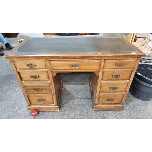 951 - Star lot : A handsome Edwardian antique desk with a dark green leather top and nine drawers to front... 